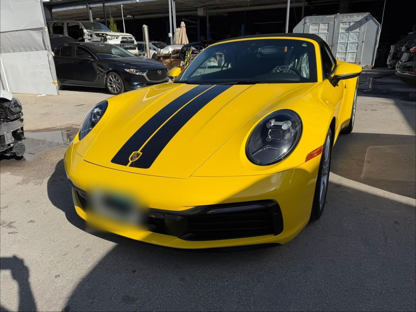 A yellow Porsche after collision repair at Autofix Plus